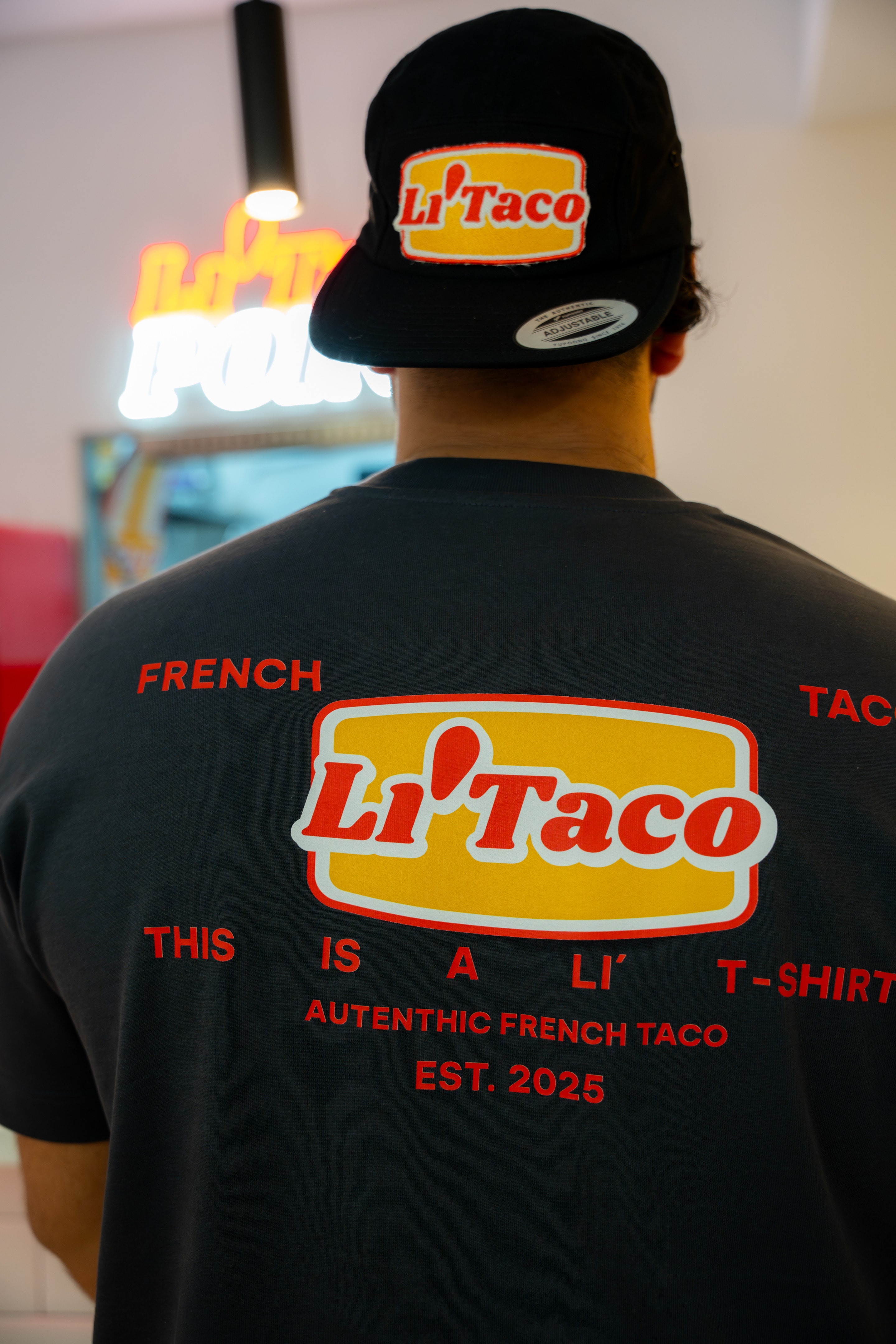 La espalda de la camiseta gris de Li'Taco: French Taco, This is a Li' T-shirt, Est. 2025